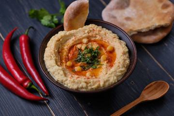 Classic hummus and homemade baked pita on the dining table. National, vegetarian food.