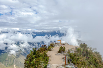 Landscape background with mountains in the clouds from the top of the Machu Piccu mountain