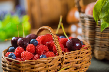 Raspberries ,cherries and blueberries in the basket