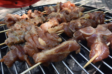 Raw pork skewer in bamboo stick