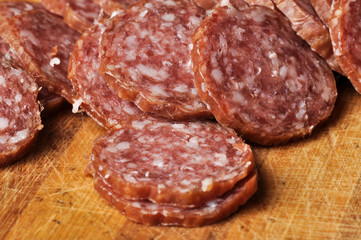 Sausage on a wooden board isolated on a white background.Food