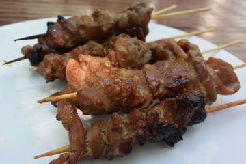 cooked pork skewer in bamboo stick