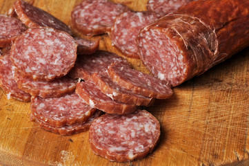 Sausage on a wooden board isolated on a white background.Food