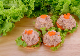 Tuna salad on biscuit and vegetable isolated on the table