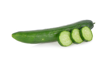 whole and sliced fresh Japanese cucumbers on white background