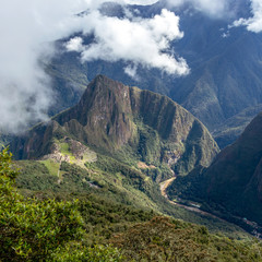 Huayna Picchu, or Wayna Pikchu, mountain in clouds rises over Machu Picchu Inca citadel, lost city of the Incas