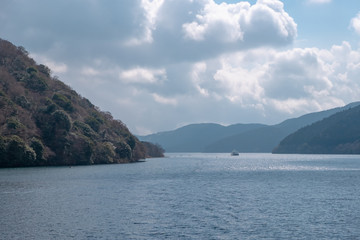 Fototapeta na wymiar Lake Ashi with boat and canal with mountain background, Hakone, Kanagawa prefecture, Japan