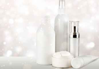 Cosmetic containers isolated on background