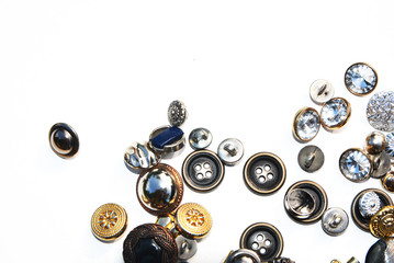 Naklejka na ściany i meble Metal sewing buttons of different sizes and shapes on an isolated background 