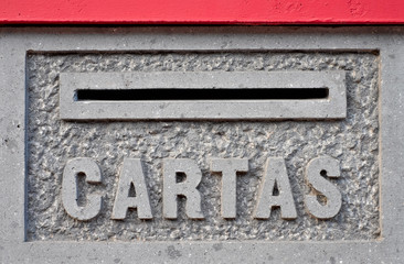 Letter box in a stone wall (Spanish: 'Cartas').