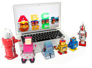 robot toys learing ABC on a laptop computer