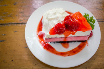 Strawberry Cake Dessert on wooden table  in cafe