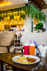 steak with white plate on wooden table