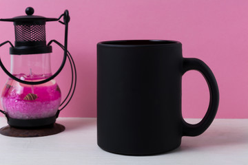 Coffee mug mockup with black metal candle lantern