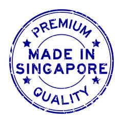 Grunge blue premium quality made in Singapore round rubber business seal stamp on white background