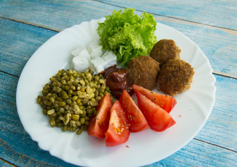 Chicken balls, lettuce, mung with tomatoes and pickled cheese