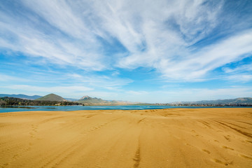 Fototapeta na wymiar Sand Dunes on the Beach and Beautiful Cloudy Sky