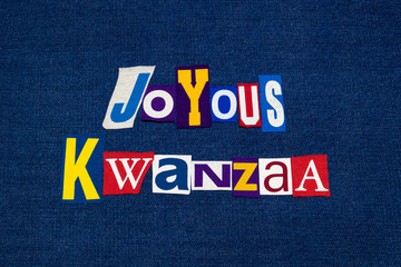 JOYOUS KWANZAA word text collage typography, multi colored fabric on blue denim, African American holiday, horizontal aspect
