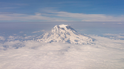 Fototapeta na wymiar Mount Rainier with Clouds from Airplane View