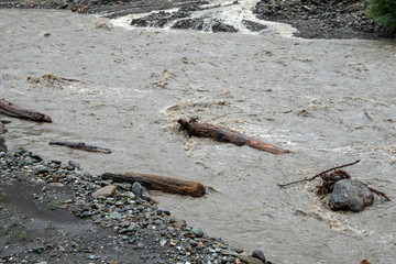 The powerful flow of a mountain river in the spring