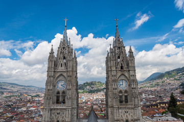 Obraz premium View of Basilica in Quito with city in background on cloudy day