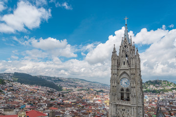 Fototapeta na wymiar View of Basilica in Quito with city in background on cloudy day