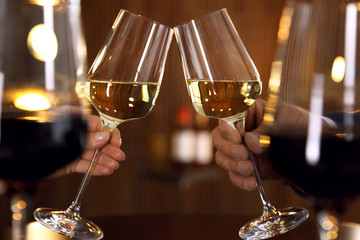 People with glasses of wine on blurred background, closeup