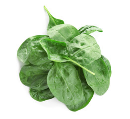 Heap of fresh green healthy baby spinach leaves isolated on white, top view
