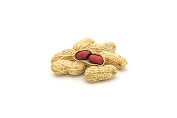 Close-up of a small pile of shelled peanuts on a white background