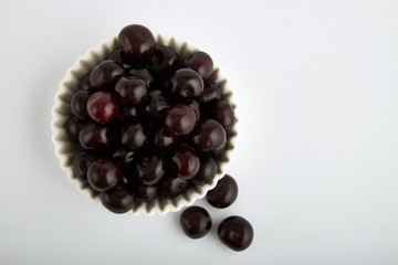 Fresh cherry on plate on wooden blue background. fresh ripe cherries. sweet cherries.