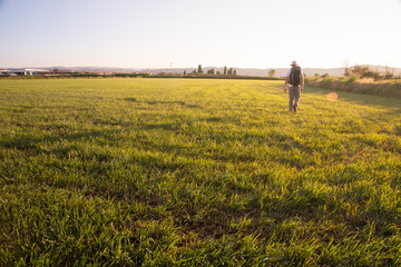 backpacker traveler walking at sunrise