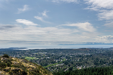 Fototapeta na wymiar Aerial panoramic view of the city of Victoria from mount Douglas park with a beautiful Pacific Ocean scene.