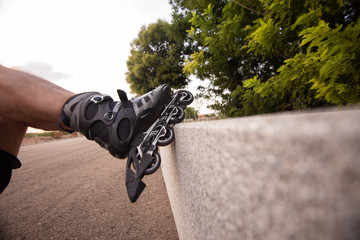 man with inline skates skating on the street