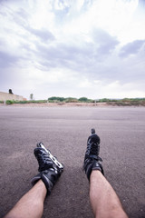 man with inline skates skating on the street
