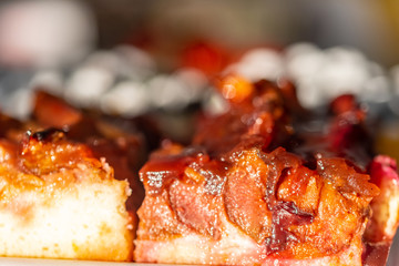 A delicious piece of fine cake with fruits on top