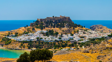 Obraz premium The historic city of Lindos and the Acropolis of Lindos on Rhodes, Greece