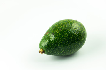 Fresh ripe Avocado, green tropical fruit with large stone seed and smooth oily healthy fruit isolated on white background.