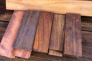 Obraz na płótnie Canvas bars blocks scales of valuable exotic tree wood ironwood, cocobolo, kingwood, blackwood for handmade DIY knife handles materials supply