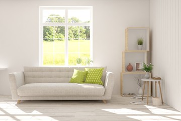Obraz premium Stylish room in white color with sofa and summer landscape in window. Scandinavian interior design. 3D illustration