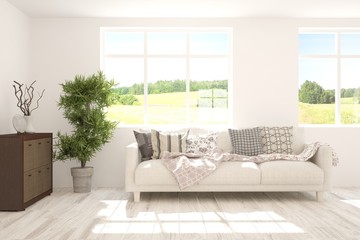 Stylish room in white color with sofa and summer landscape in window. Scandinavian interior design. 3D illustration