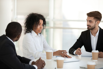 African American businesswoman discuss project at company meeting