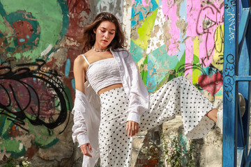 Young beautiful lady wearing a stylish white top.Portrait shooting of a stylish girl.Trends summer 2019.