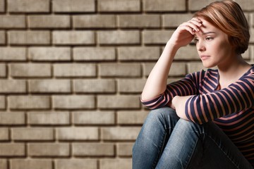 Young woman crying on background