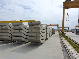 Precast concrete plant with blue sky in the construction site, in storage yard area at Thailand, Space for text in template, Concrete Tunnel Segments