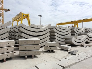 Precast concrete plant with blue sky in the construction site, in storage yard area at Thailand, Space for text in template, Concrete Tunnel Segments
