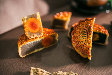 Beautiful Moon cakes and teacup on wooden table. Mid autumn festival Mooncake in Vietnam. Royalty high quality free stock image.