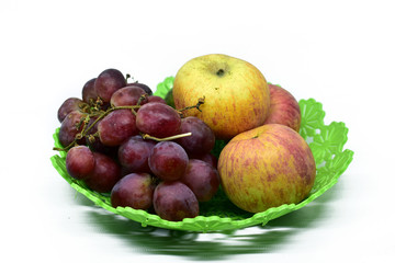Naklejka na ściany i meble Fresh juicy fruits on the plastic tray, isolated on white background