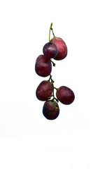 fresh red grapes isolated on a white background