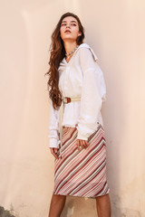 Young beautiful lady wearing a stylish white shirt.Portrait shooting of a stylish girl.Trends...
