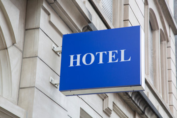 Obraz premium Blue Hotel Sign on Building